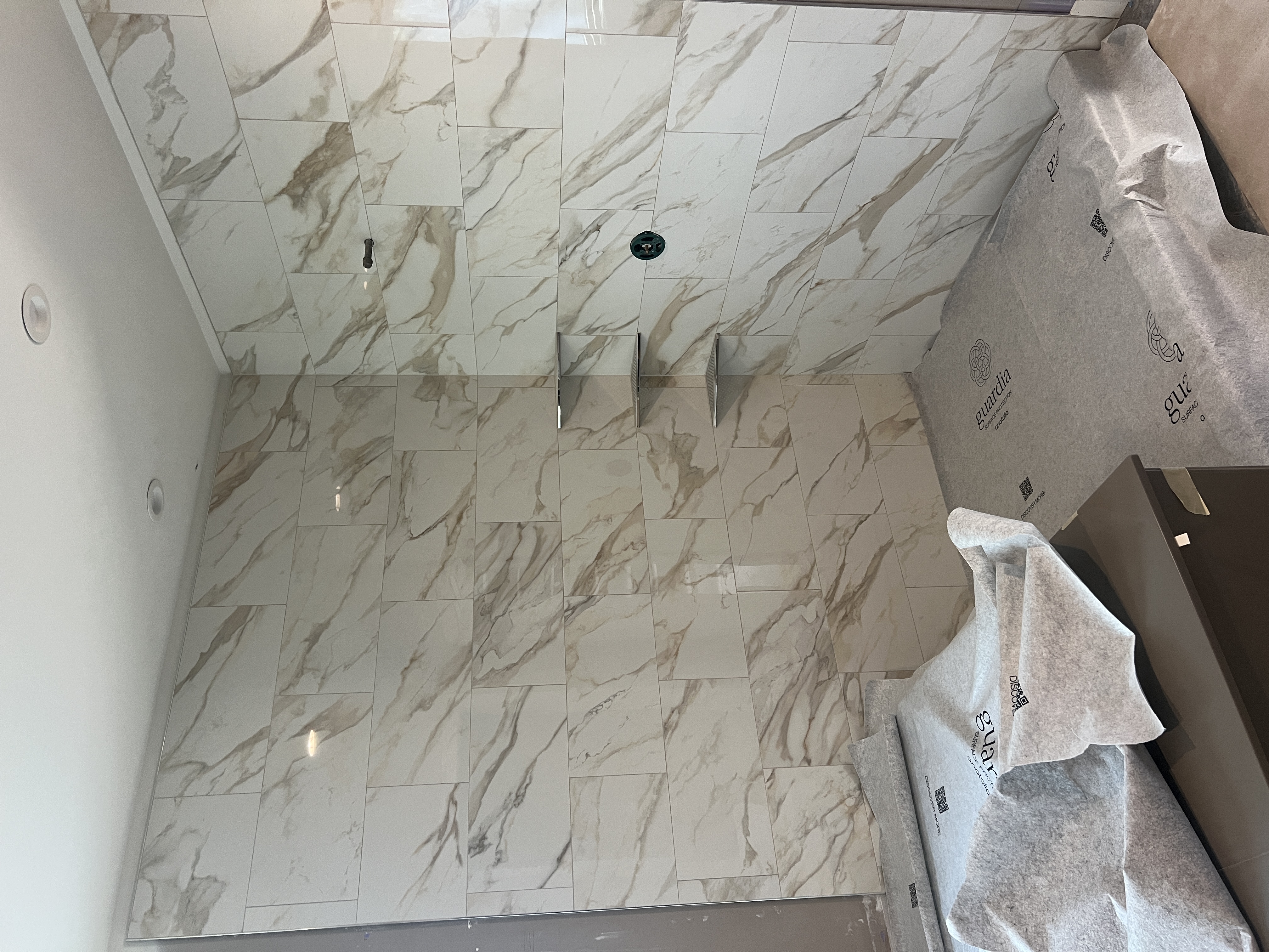 Large format marble-look porcelain tile shower remodel in St. Louis