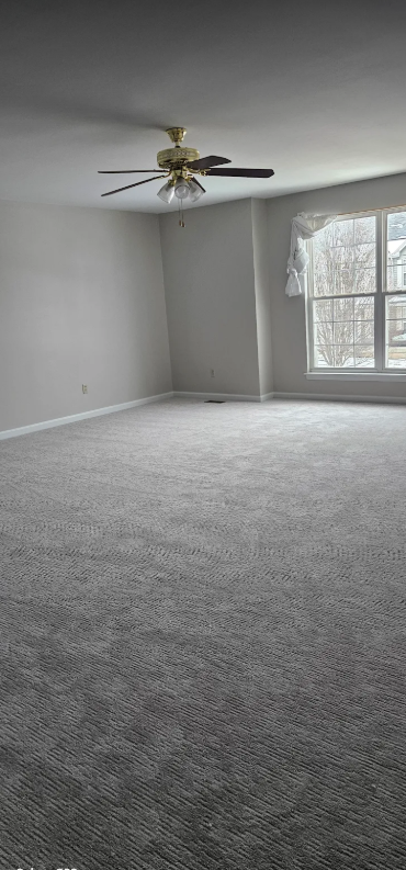 Mohawk Sculptured Touch II Perma Frost carpet in spacious bedroom with bay window