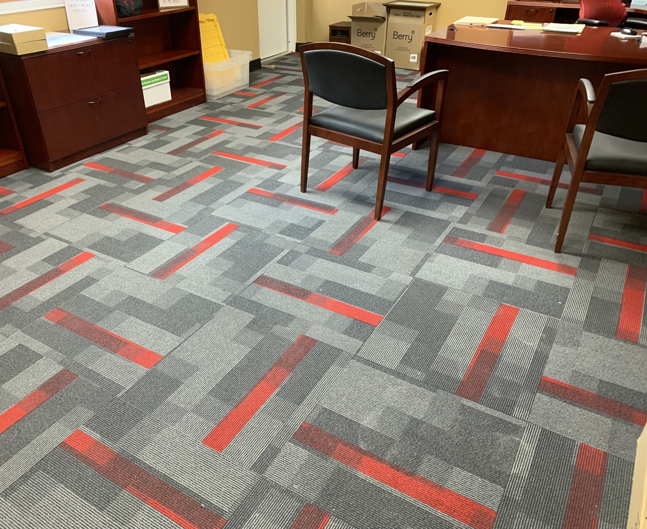 Red and grey carpet tiles in commercial office