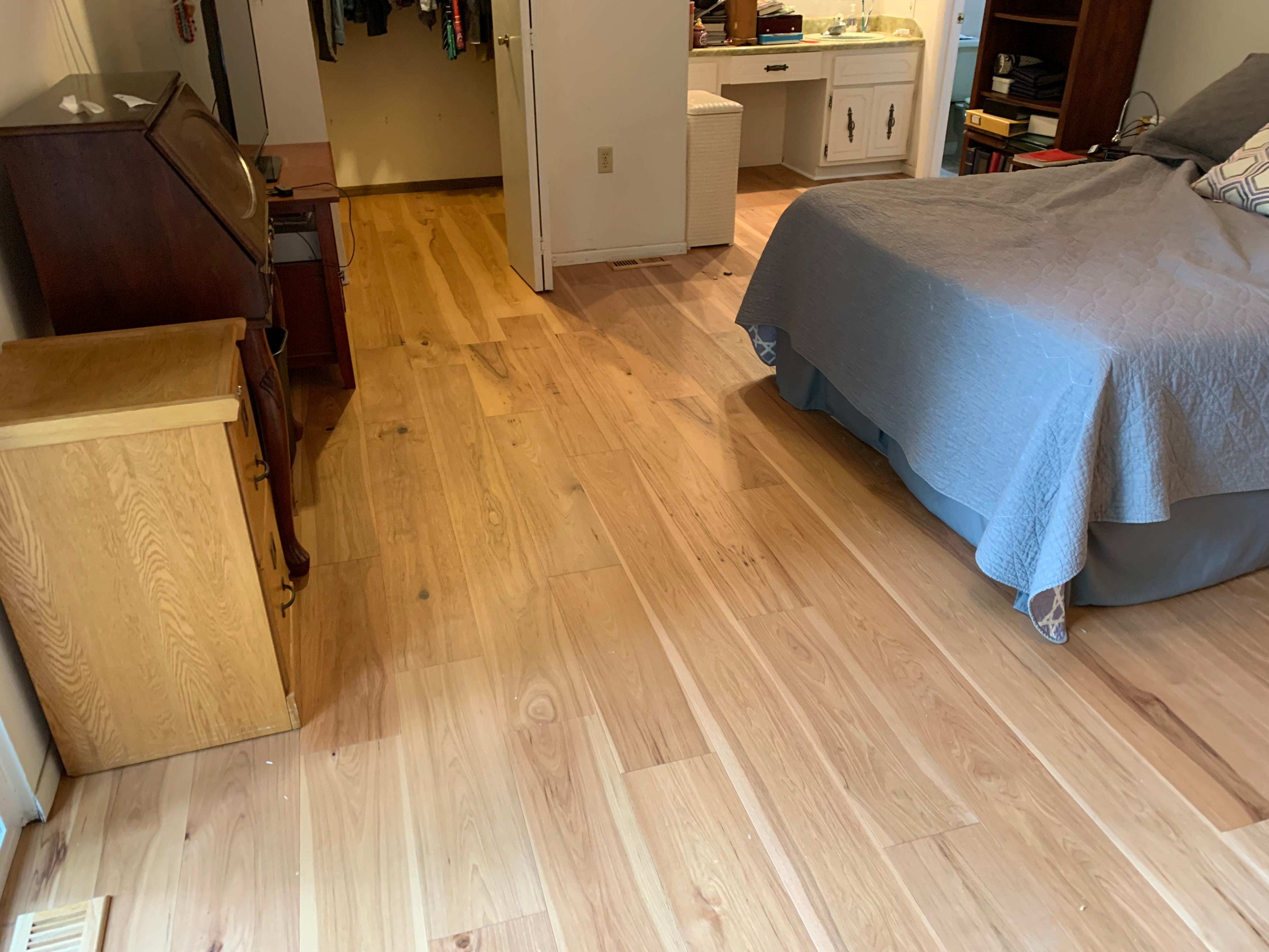 Natural hardwood flooring in bedroom