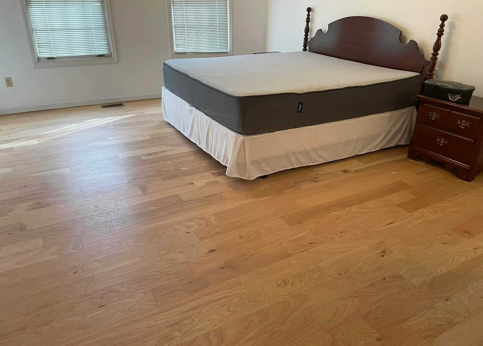 Natural hardwood flooring in bedroom