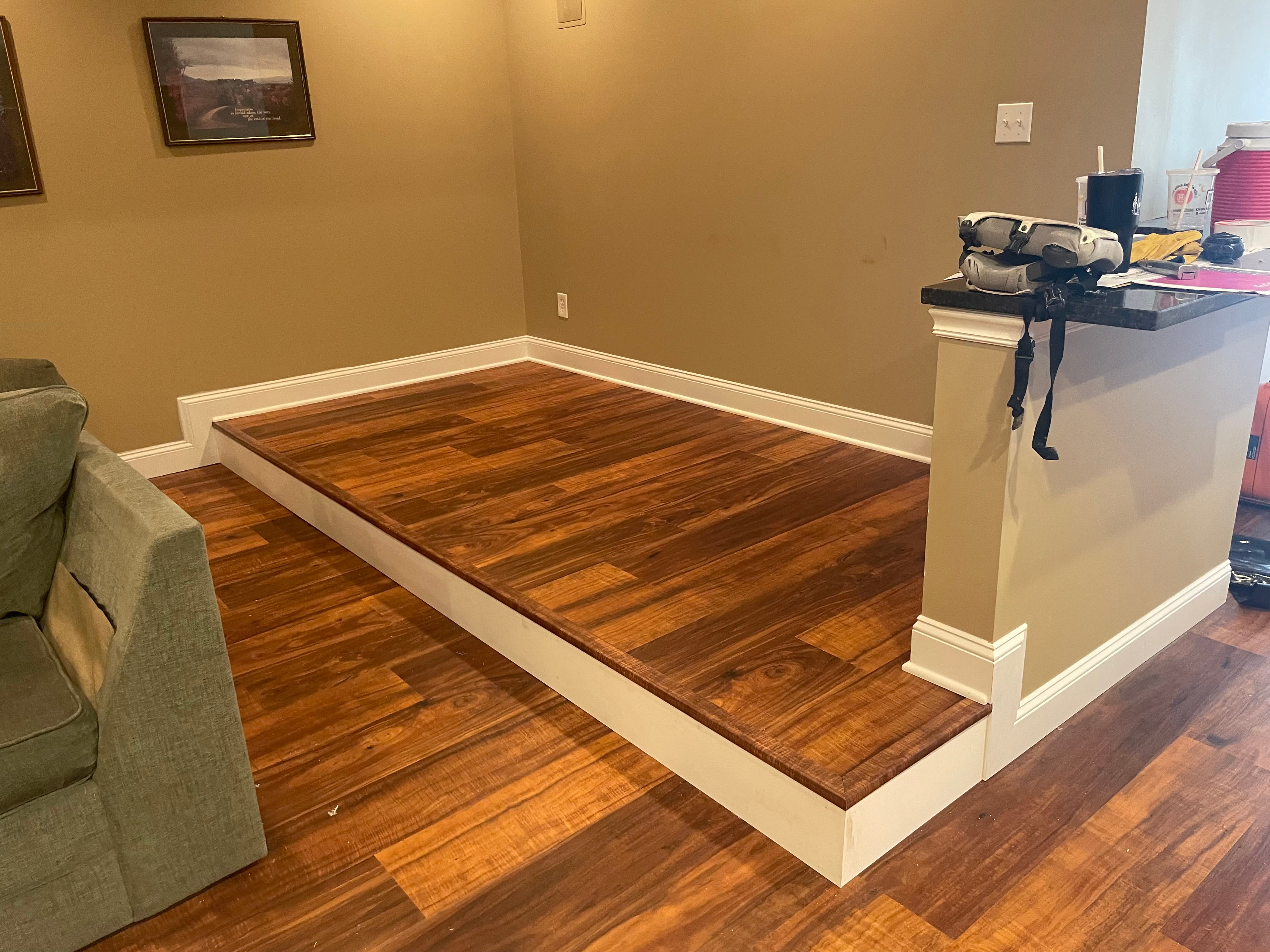 Hardwood flooring on raised platform with custom detail