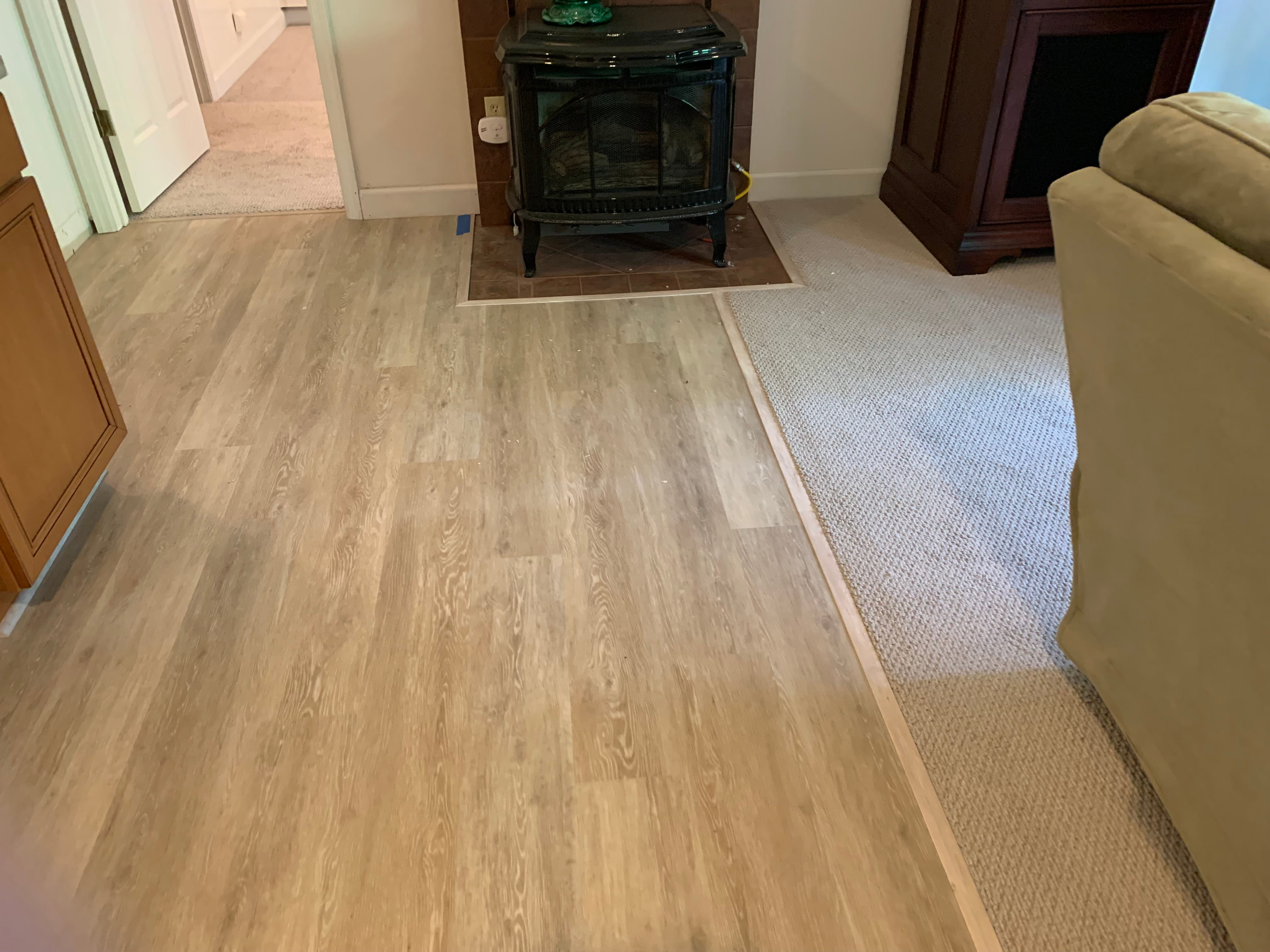 Hardwood flooring transition next to wood stove