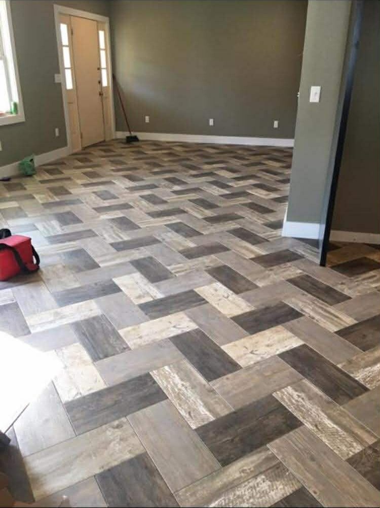 Herringbone wood-look tile installed in an Oakville home entryway