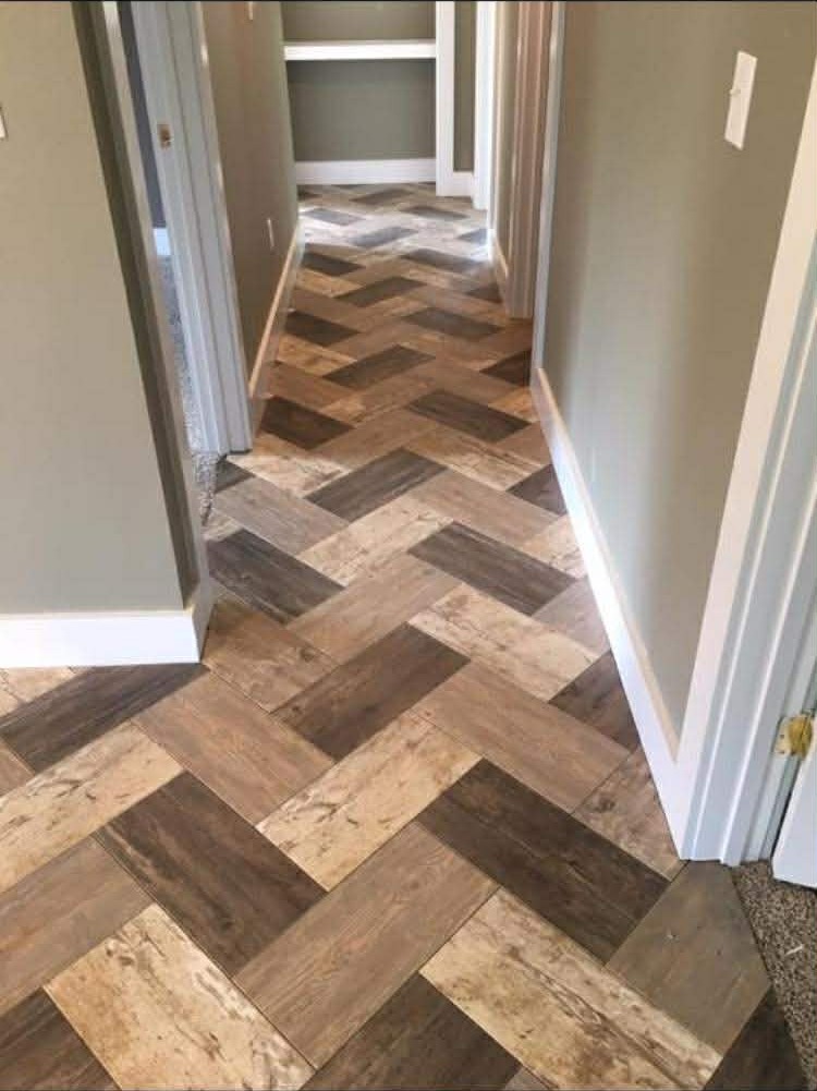 Herringbone wood-look pattern installed in a West County home hallway