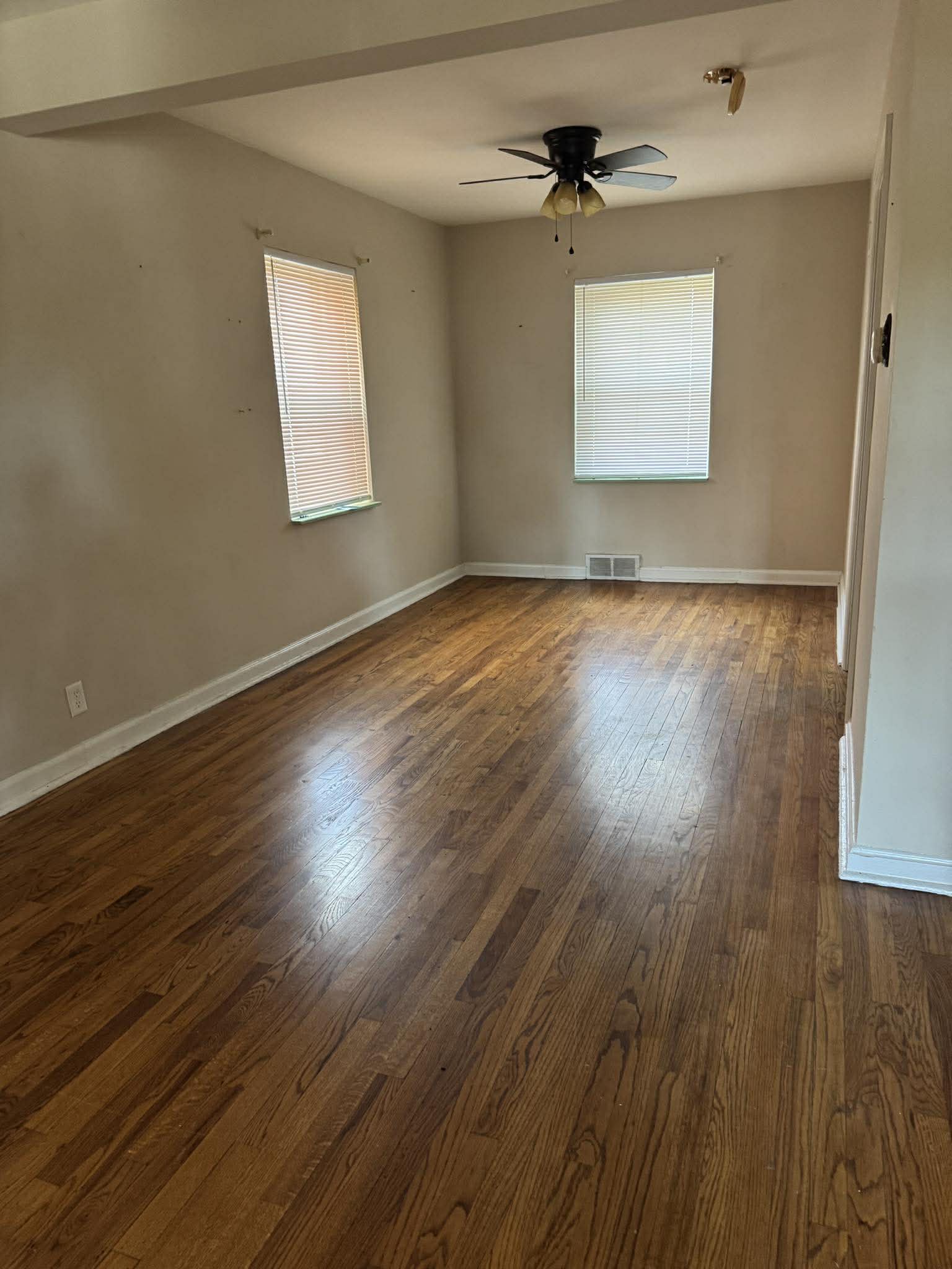 Refinished original red oak hardwood floors in a Kirkwood bungalow
