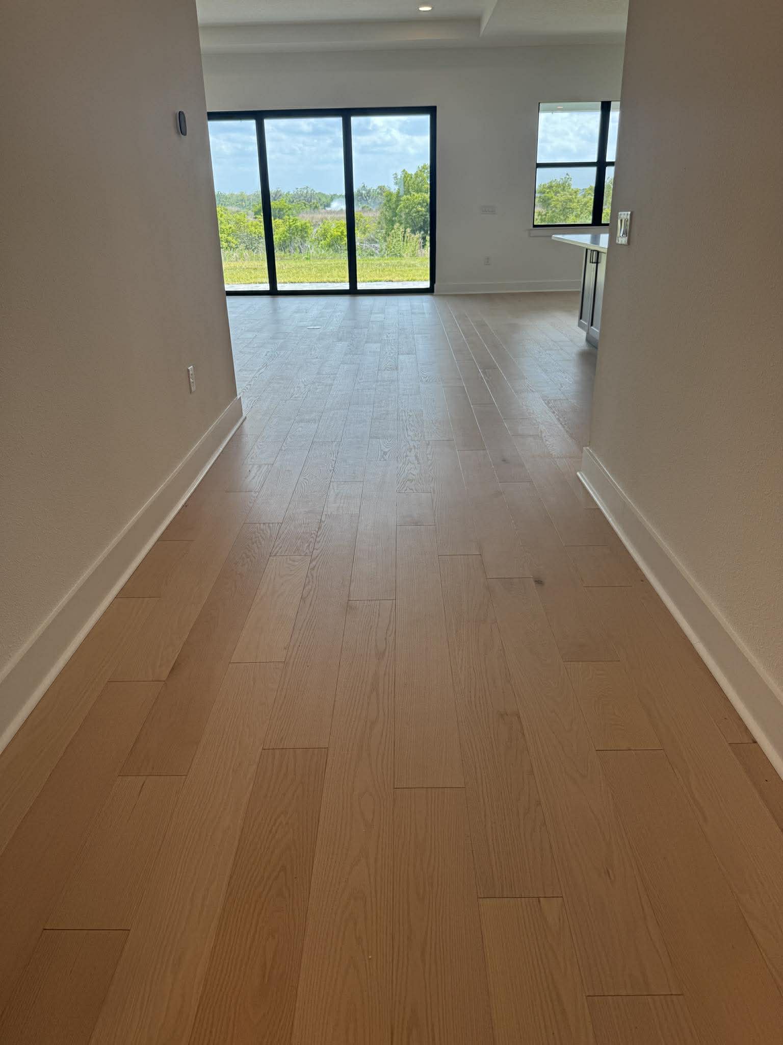Light natural hardwood in modern open-plan living space