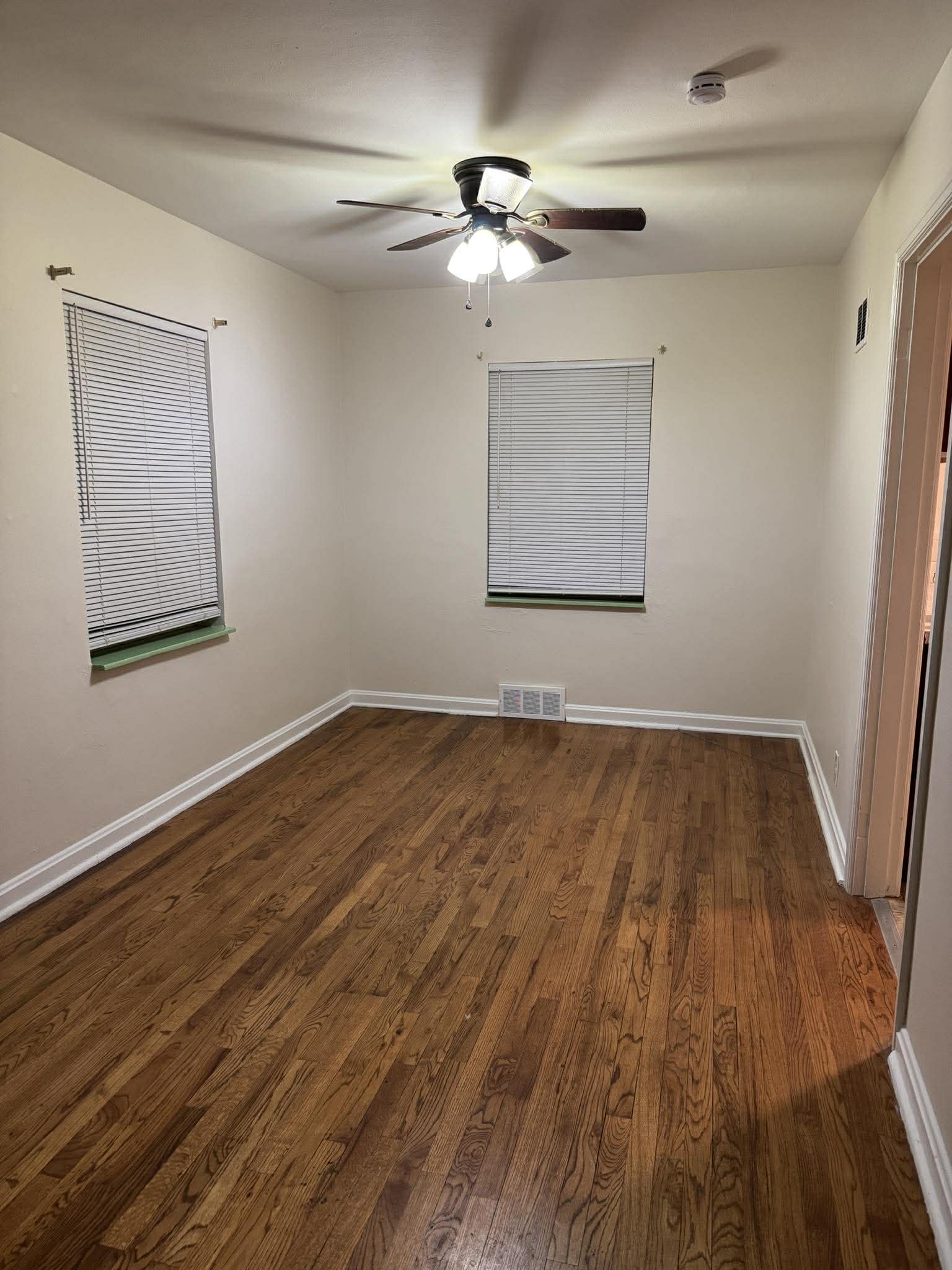 Dark refinished hardwood bedroom floors