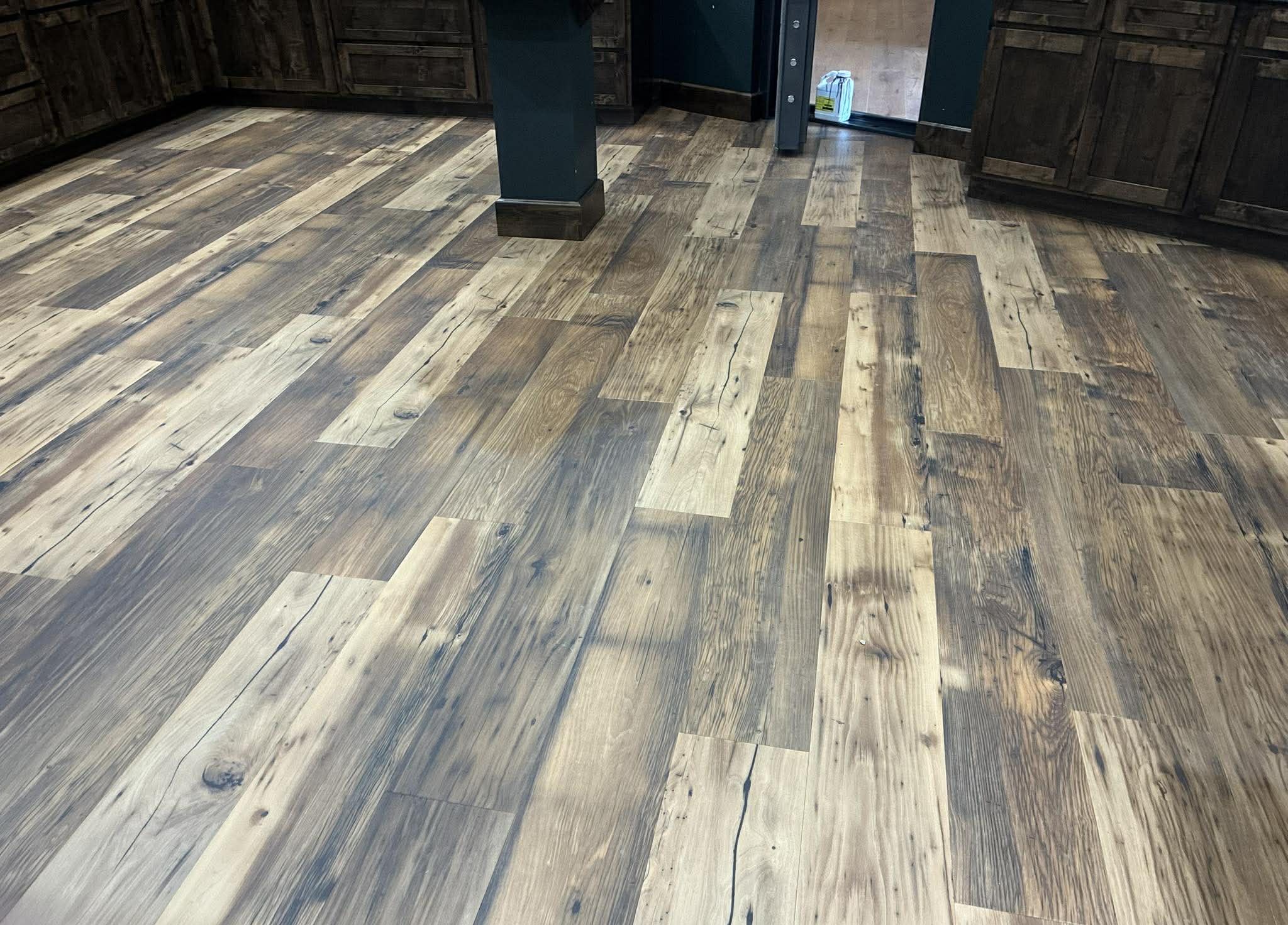 Rustic reclaimed-look hardwood flooring