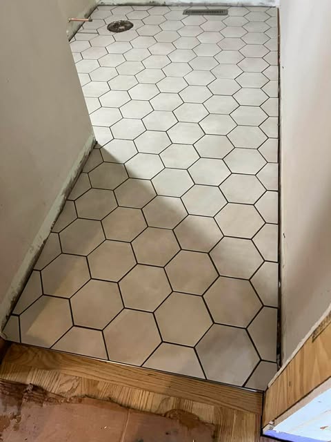 Hexagonal tile shower floor installation