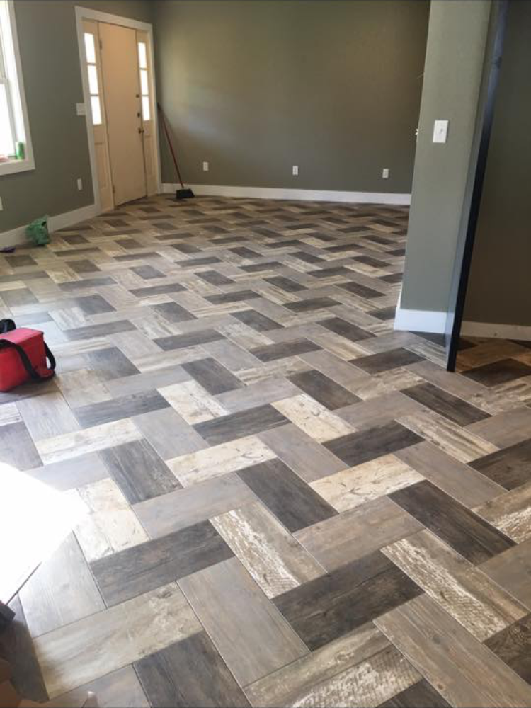Herringbone wood-look tile kitchen floor installation by Kelly's Flooring