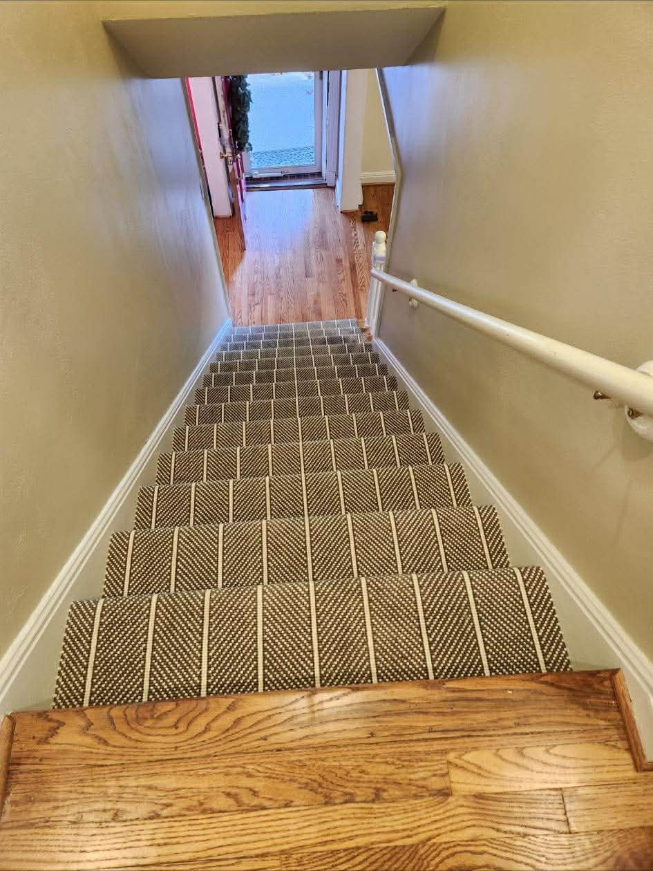 Navy geometric carpet on narrow stairs
