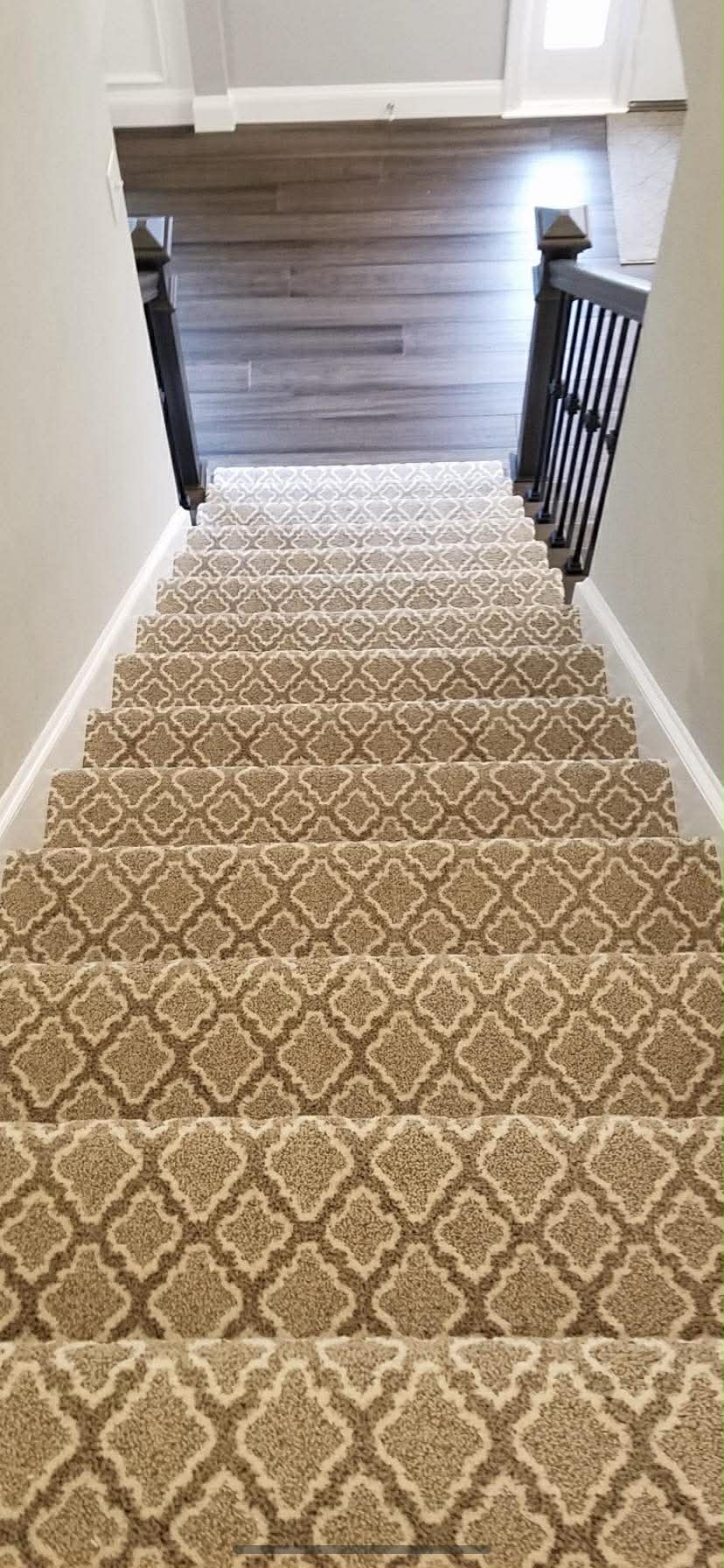 Moroccan trellis pattern carpet runner on staircase
